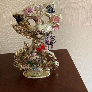 Earring holder with 17 pair of little girls earrings about 5 1/2 inches tall